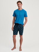 Men model is wearing Bermudas made of 100% Cotton in Black, Patterned from the RMX Sleep Leisure series by CALIDA, Outfit