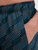 Men model is wearing Bermudas made of 100% Cotton in Black, Patterned from the RMX Sleep Leisure series by CALIDA, Detail