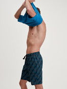 Men model is wearing Bermudas made of 100% Cotton in Black, Patterned from the RMX Sleep Leisure series by CALIDA, Additional Image