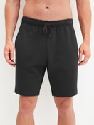 Men model is wearing Bermudas with side pockets made of Cotton in Black, Unicoloured from the RMX Lounge Lecce series by CALIDA, Front view