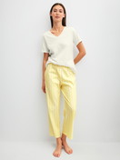 Women model is wearing 7/8 pyjama trousers made of 100% Cotton in Yellow, Striped from the Favourites Ocean series by CALIDA, Outfit