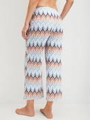 Women model is wearing 7/8 pyjama trousers made of 100% Cotton in Blue, Patterned from the Favourites Tiles series by CALIDA, Back view