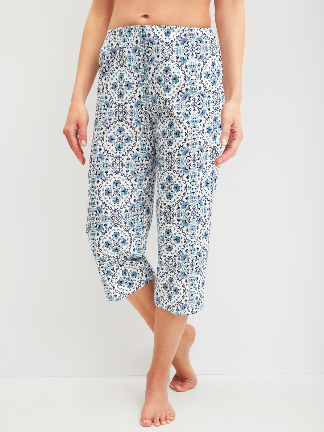 Women model is wearing 3/4 Pyjama bottom made of 100% Cotton in Blue, Patterned from the Favourites Tiles series by CALIDA, Front view