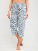 Women model is wearing 3/4 Pyjama bottom made of 100% Cotton in Blue, Patterned from the Favourites Tiles series by CALIDA, Front view