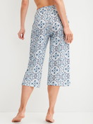 Women model is wearing 3/4 Pyjama bottom made of 100% Cotton in Blue, Patterned from the Favourites Tiles series by CALIDA, Back view