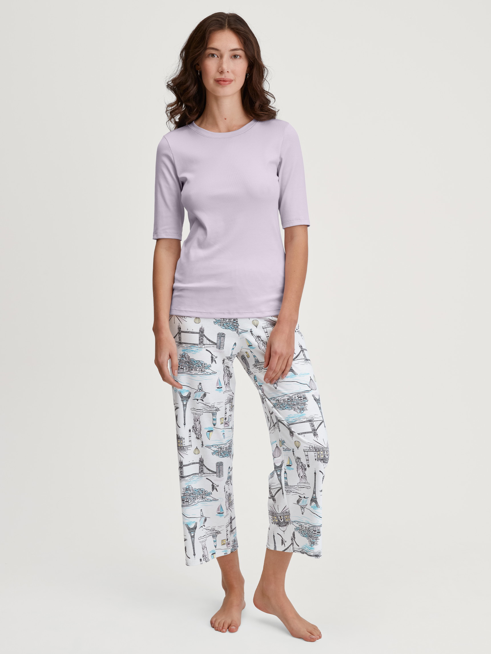 Women model is wearing 7/8 Pyjama bottom made of 100% Cotton in White, Patterned from the Favourites Journey series by CALIDA, Outfit