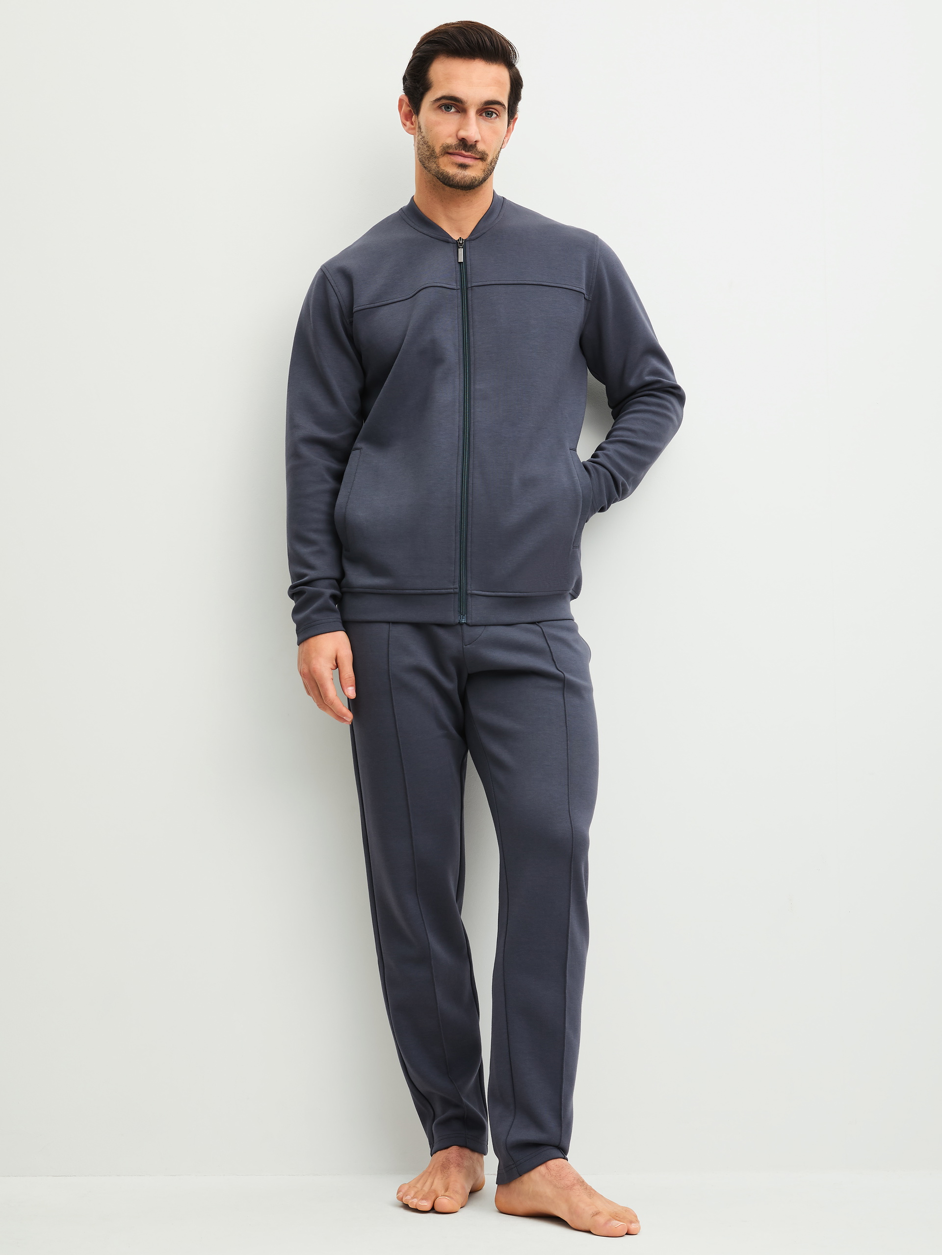 Men model is wearing Lounge trousers made of Cotton in Grey, Unicoloured from the RMX Lounge Casual series by CALIDA, Outfit