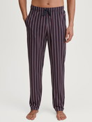 Men model is wearing Pyjama Bottoms with Side Pockets made of 100% Cotton in Red, Checked from the Remix Basic Sleep series by CALIDA, Front view
