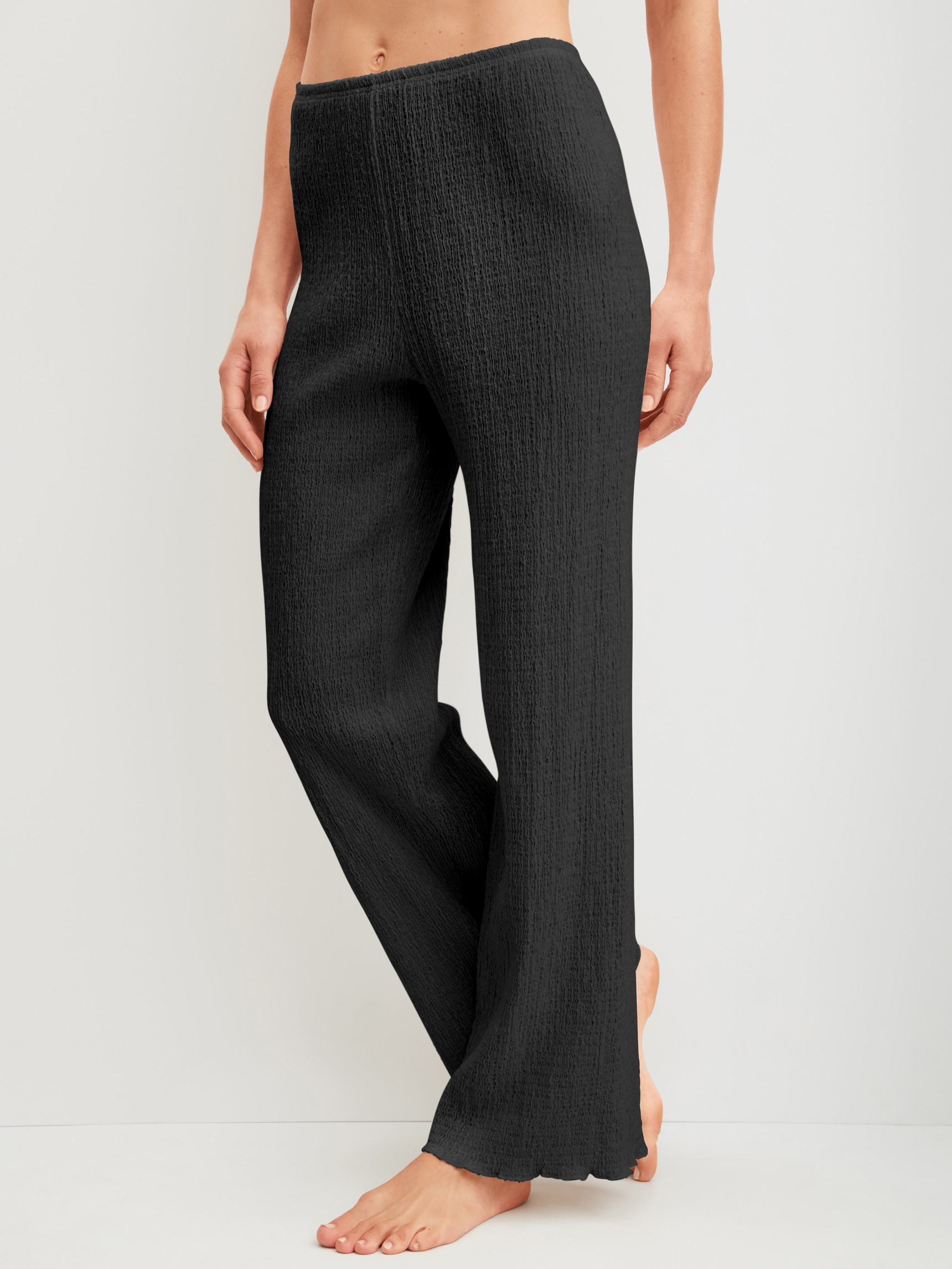 Women model is wearing Pyjama bottom made of Cotton in Black, Unicoloured from the Favourites Layering series by CALIDA, Front view