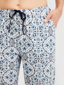 Women model is wearing Pyjama trousers with side pockets made of 100% Cotton in Blue, Patterned from the Favourites Tiles series by CALIDA, Detail