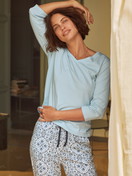 Women model is wearing Pyjama trousers with side pockets made of 100% Cotton in Blue, Patterned from the Favourites Tiles series by CALIDA, Additional Image