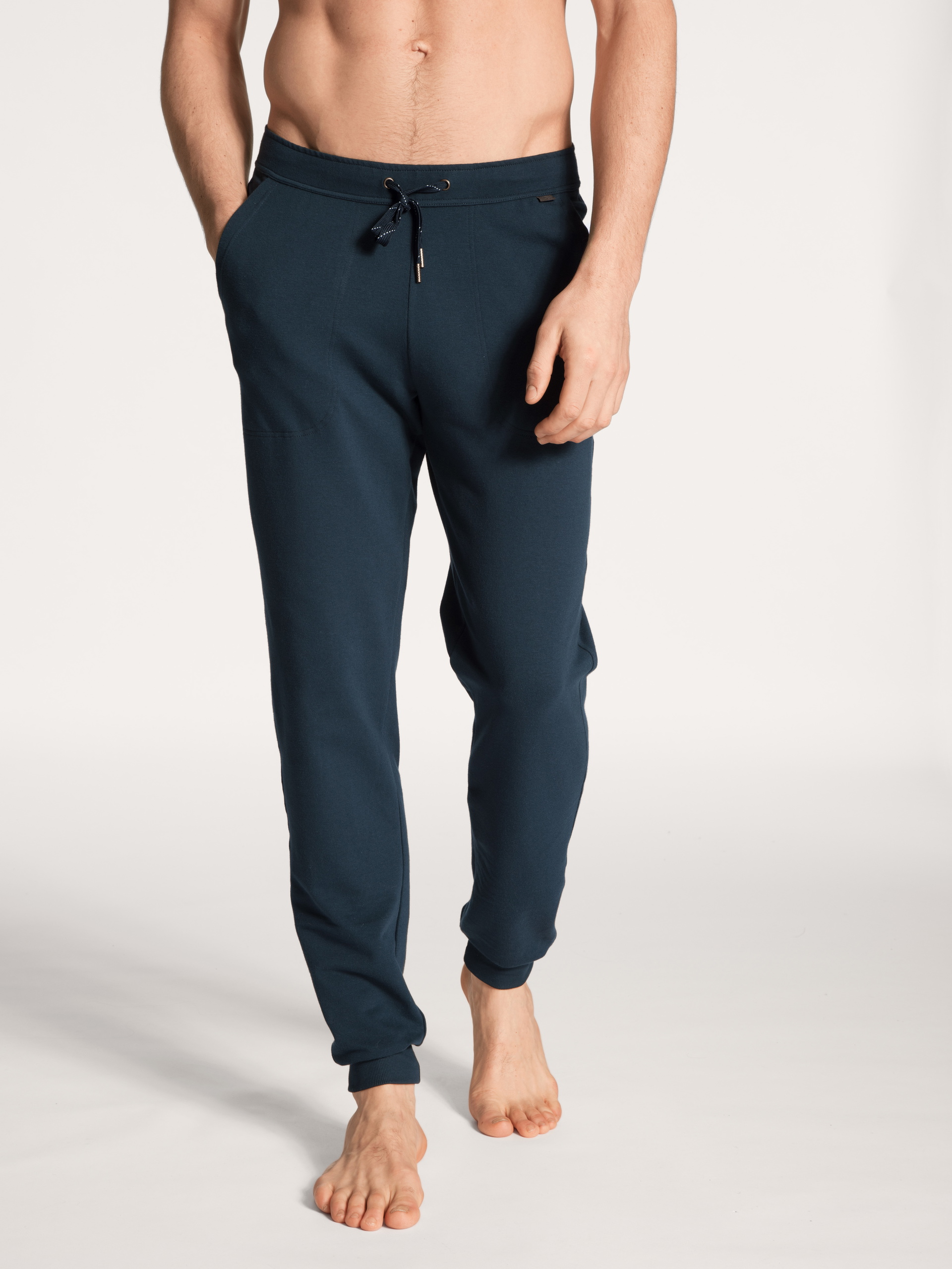 Men model is wearing Jogging pants with side pockets made of Cotton in Blue, Unicoloured from the Remix Basic Lounge series by CALIDA, Front view