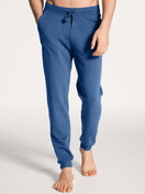 Men model is wearing Jogging pants with side pockets made of Cotton in Blue, Unicoloured from the Remix Xtra series by CALIDA, Front view