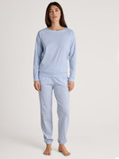 Women model is wearing Pyjama bottom with cuffs made of 100% Cotton in Blue, Patterned from the Favourites Sleep series by CALIDA, Outfit
