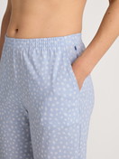 Women model is wearing Pyjama bottom with cuffs made of 100% Cotton in Blue, Patterned from the Favourites Sleep series by CALIDA, Additional Image