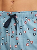 Men model is wearing Pyjama Bottoms with Side Pockets made of 100% Cotton in Blue, Patterned from the RMX Sleep Holiday series by CALIDA, Detail