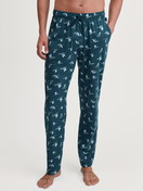 Men model is wearing Pyjama Bottoms with Side Pockets made of 100% Cotton in Green, Patterned from the RMX Sleep Weekend series by CALIDA, Front view