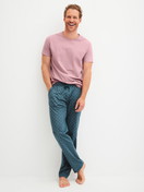 Men model is wearing Pyjama Bottoms with Side Pockets made of 100% Cotton in Turquoise, Patterned from the RMX Sleep Leisure series by CALIDA, Outfit