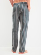 Men model is wearing Pyjama Bottoms with Side Pockets made of 100% Cotton in Green, Striped from the RMX Sleep Leisure series by CALIDA, Back view