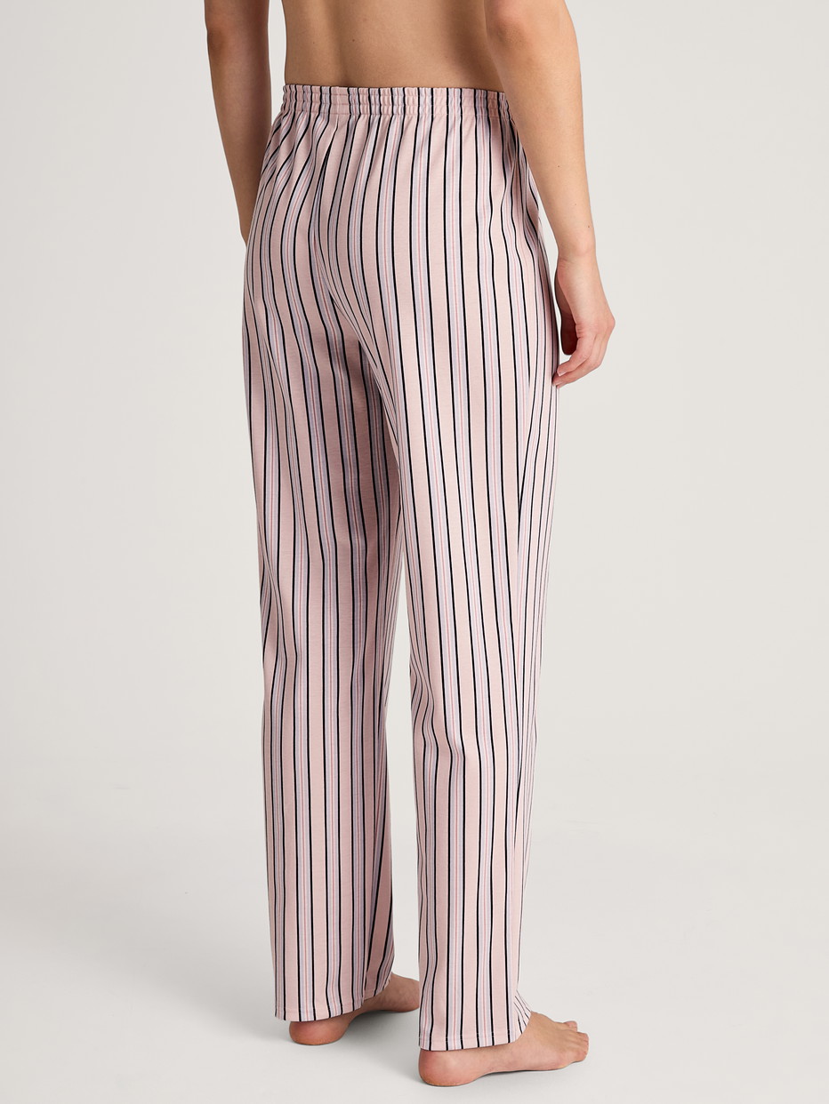 Women model is wearing Pyjama bottom made of 100% Cotton in Pink, Striped from the Favourites Sleep series by CALIDA, Back view