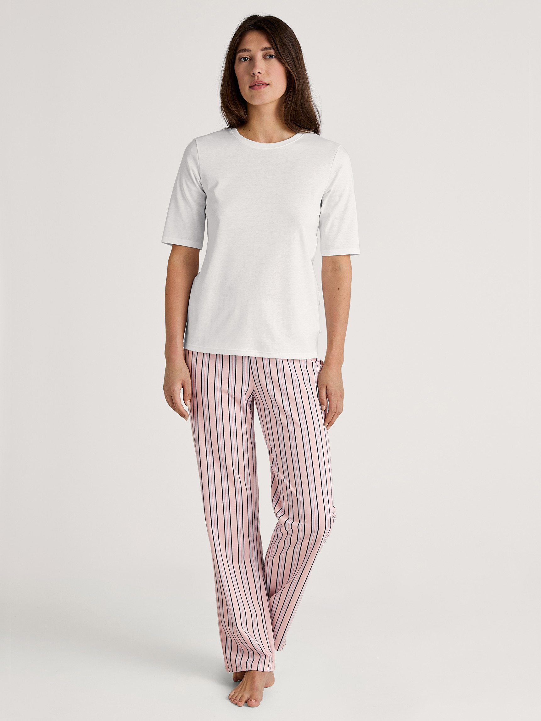 Women model is wearing Pyjama bottom made of 100% Cotton in Pink, Striped from the Favourites Sleep series by CALIDA, Outfit