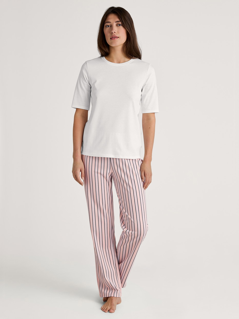 Women model is wearing Pyjama bottom made of 100% Cotton in Pink, Striped from the Favourites Sleep series by CALIDA, Outfit