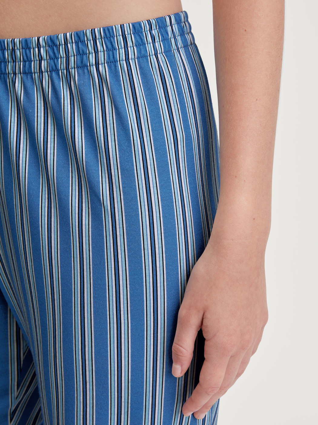 Women model is wearing Pyjama bottom made of 100% Cotton in Blue, Striped from the Favourites Journey series by CALIDA, Detail