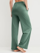 Women model is wearing Pyjama bottom made of Modal in Green, Unicoloured from the DSW Balancing series by CALIDA, Back view