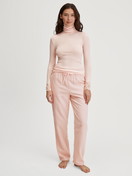 Women model is wearing Flannel trousers made of 100% Cotton in Beige, Unicoloured from the Favourites Universe series by CALIDA, Outfit