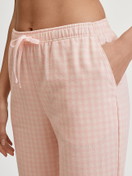 Women model is wearing Flannel trousers made of 100% Cotton in Beige, Unicoloured from the Favourites Universe series by CALIDA, Front view