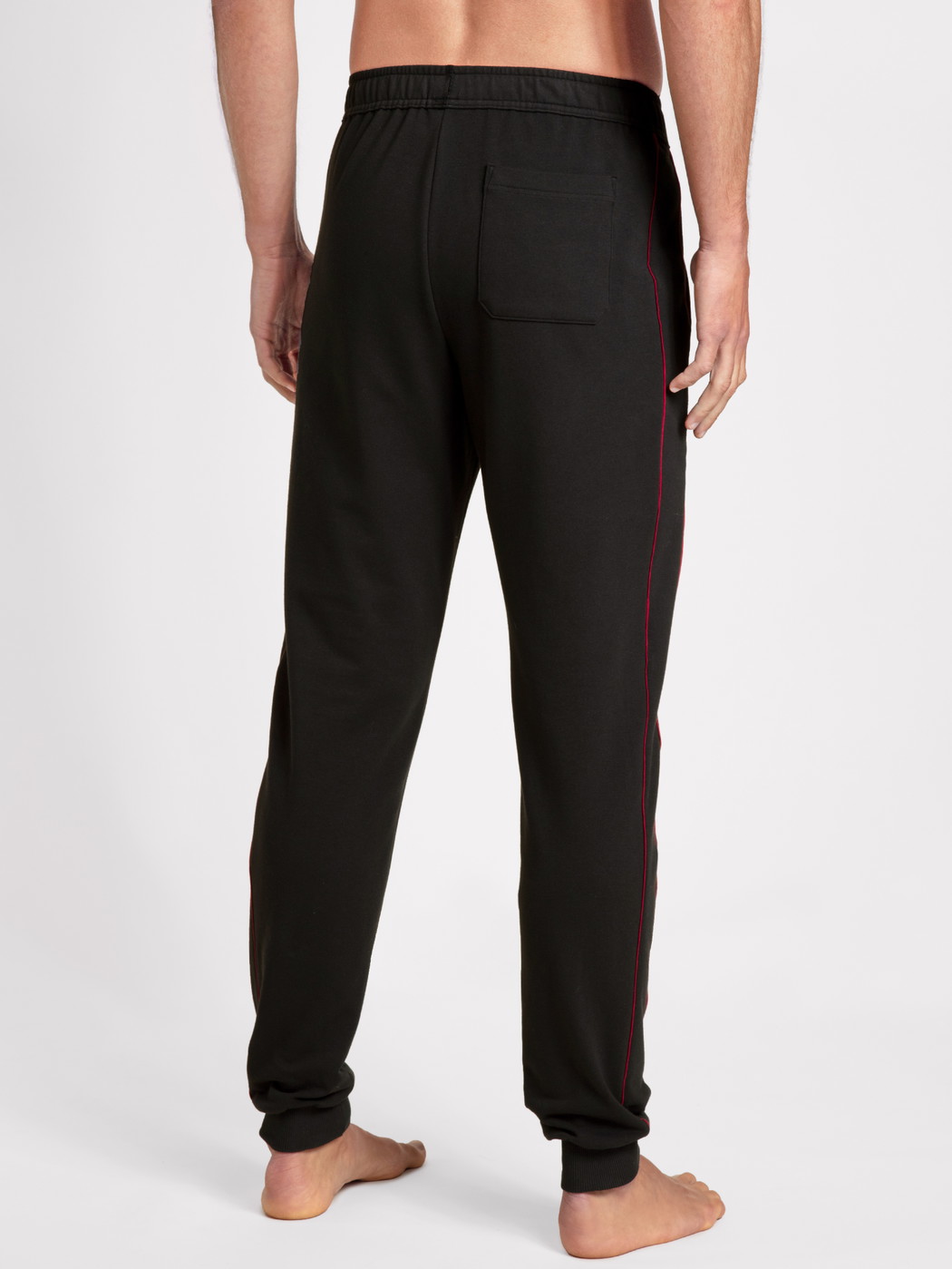 Men model is wearing Sweatpants made of Cotton in Black, Unicoloured from the Remix Basic Lounge series by CALIDA, Back view