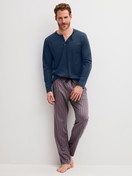 Men model is wearing Pyjama Bottoms with Side Pockets made of Cotton in Brown, Striped from the RMX Sleep Superlight series by CALIDA, Outfit