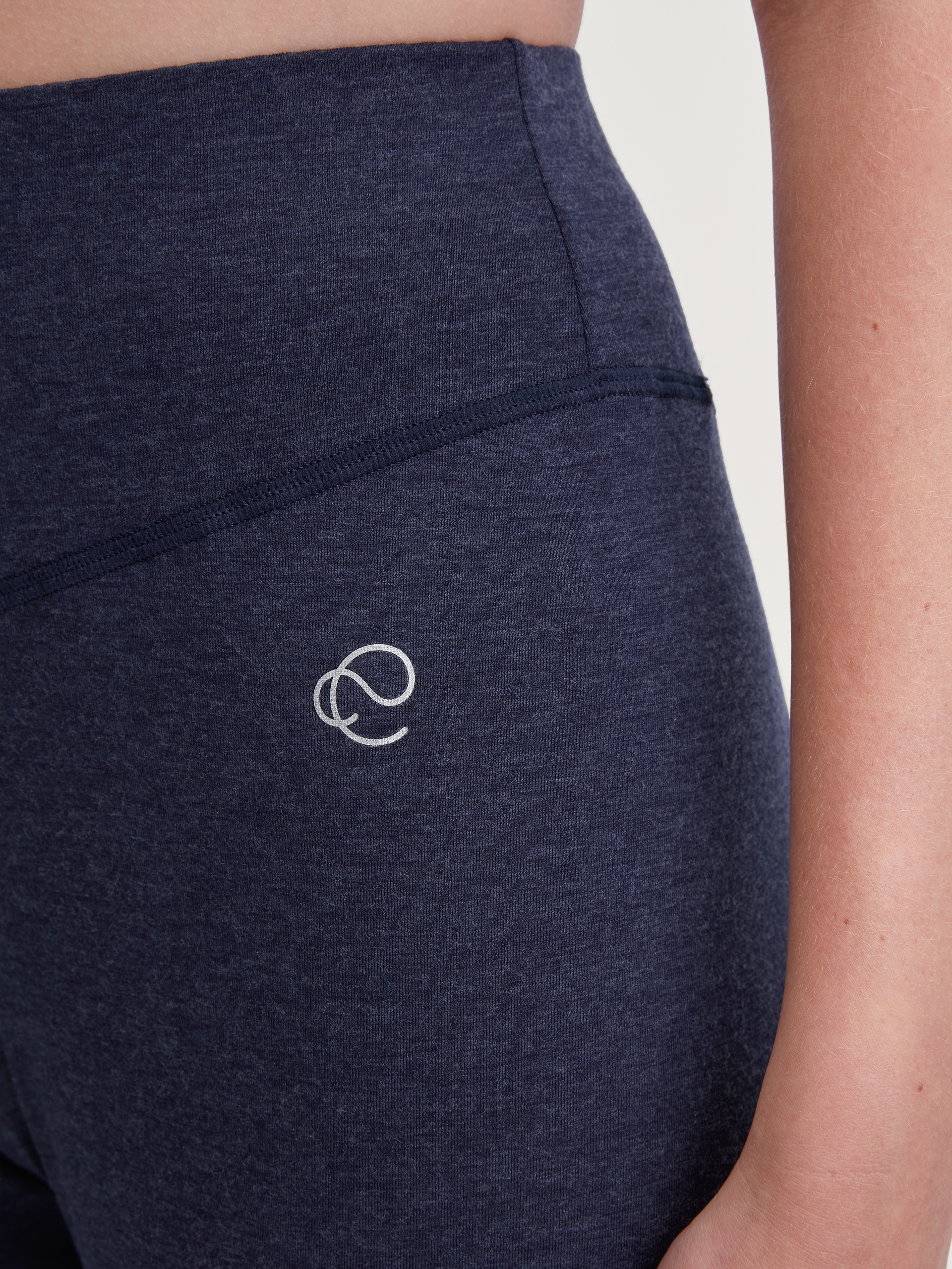 Women model is wearing Pyjama bottom with cuffs made of Lyocell in Blue, Unicoloured from the DSW Warming series by CALIDA, Detail