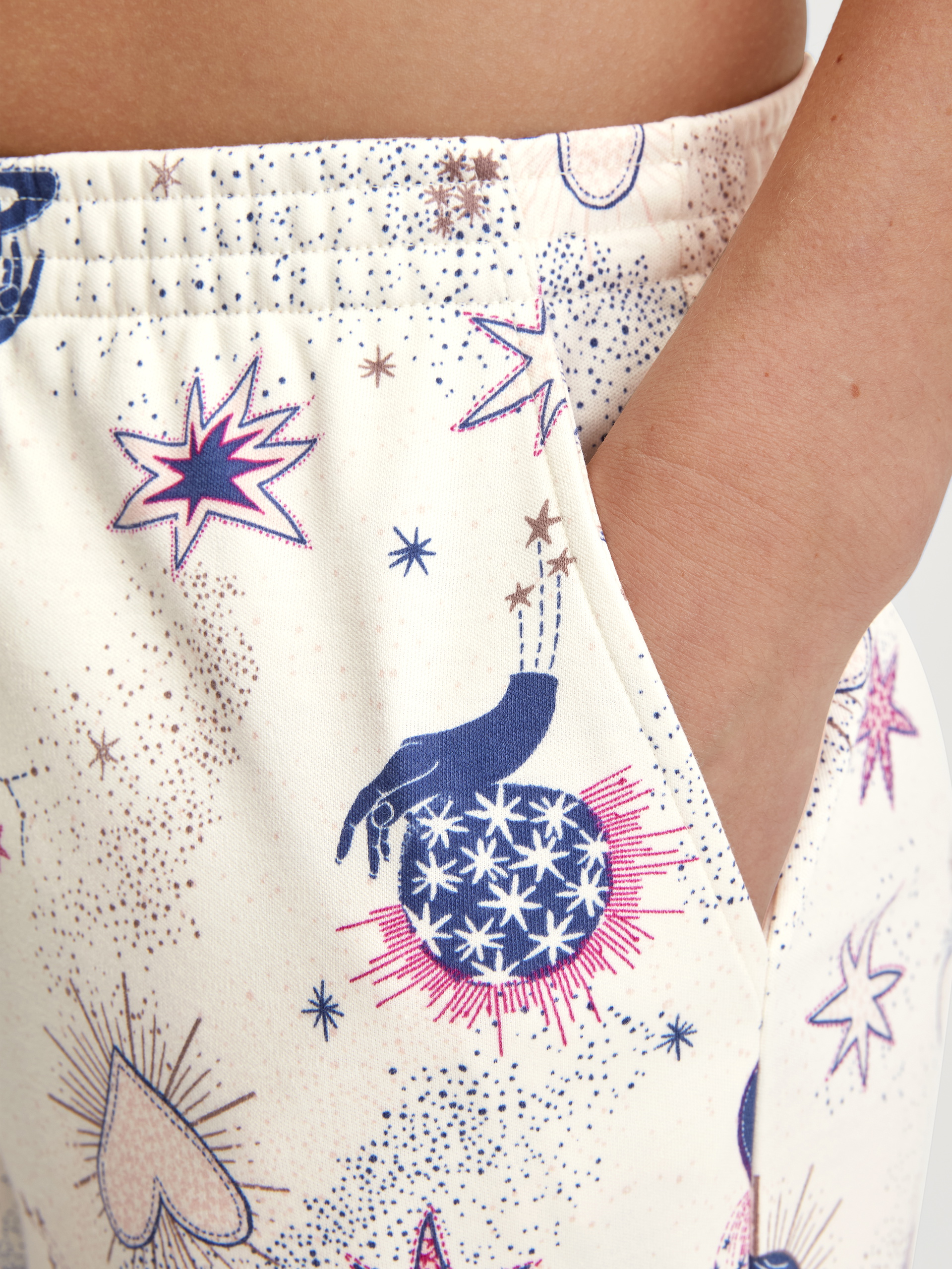 Women model is wearing Pyjama Bottoms with Side Pockets made of 100% Cotton in Beige, Patterned from the Favourites Universe series by CALIDA, Detail