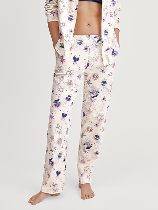 Women model is wearing Pyjama Bottoms with Side Pockets made of 100% Cotton in Beige, Patterned from the Favourites Universe series by CALIDA, Front view