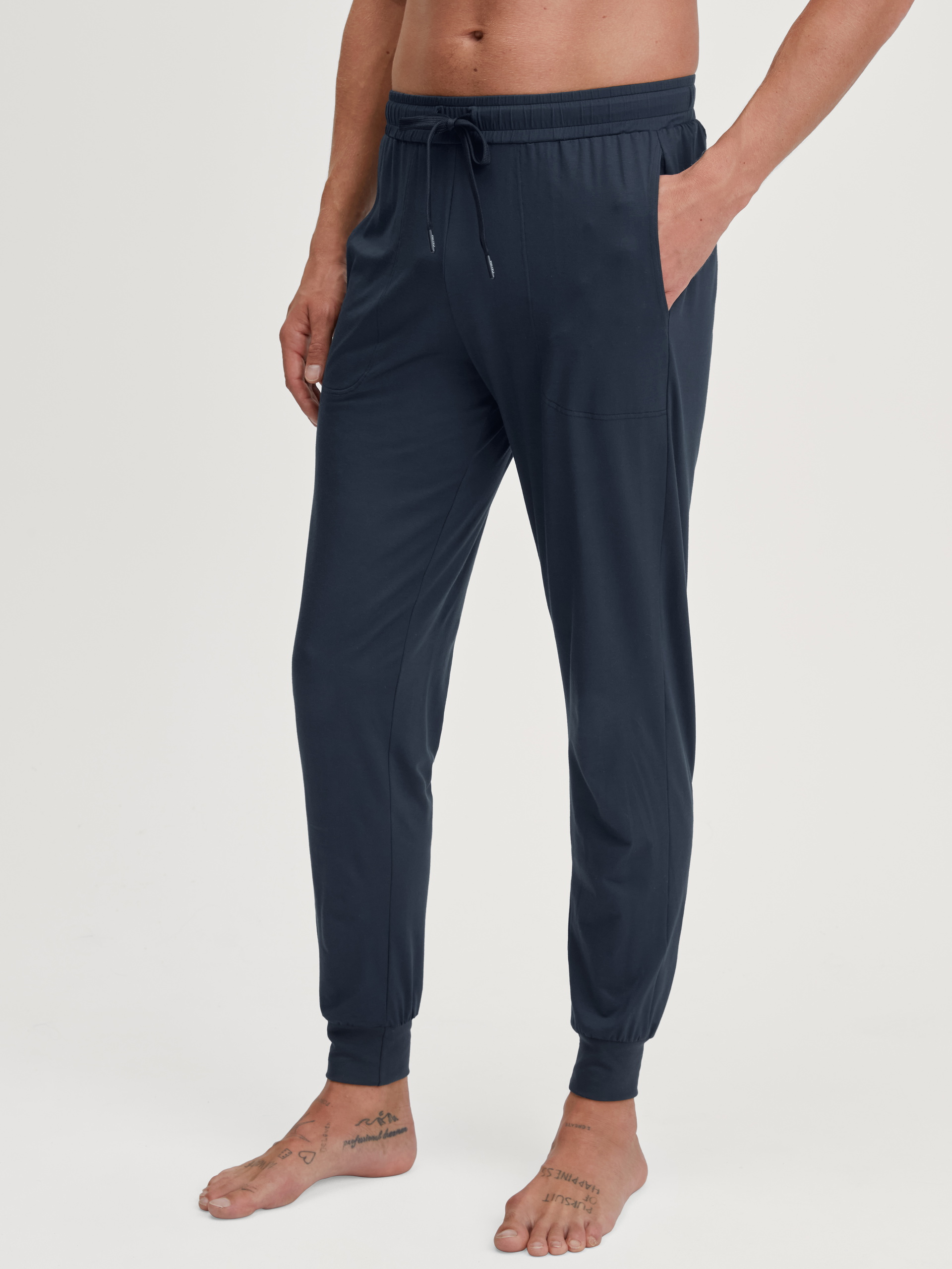 Men model is wearing Pyjama bottom with cuffs made of Modal in Blue, Unicoloured from the DSW Balancing series by CALIDA, Front view