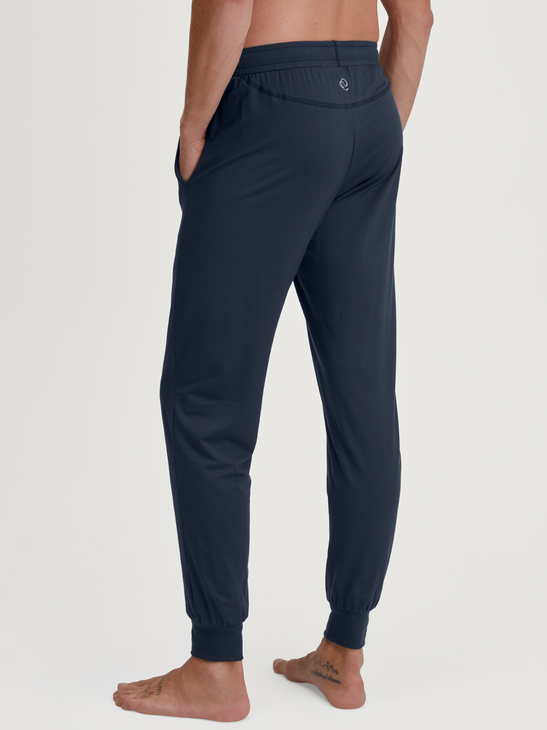 Men model is wearing Pyjama bottom with cuffs made of Modal in Blue, Unicoloured from the DSW Balancing series by CALIDA, Back view