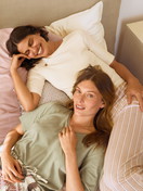 Women model is wearing Pyjama trousers with side pockets made of Cotton in Beige, Striped from the Favourites Arts series by CALIDA, Outfit