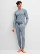 Men model is wearing Pyjama bottom with cuffs made of Lyocell in Grey, Unicoloured from the DSW Warming series by CALIDA, Outfit