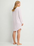 Women model is wearing Long Sleeve Nightdress – 100 cm Length made of Modal in Pink, Unicoloured from the Striped Dreams series by CALIDA, Back view