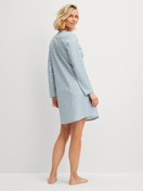 Women model is wearing Long-sleeve nightdress, length 95 cm made of 100% Cotton in Blue, Patterned from the Midnight Dreams series by CALIDA, Back view