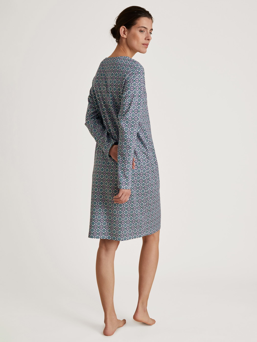 Women model is wearing Nightdress made of 100% Cotton in Turquoise, Motif from the Spring Nights series by CALIDA, Back view