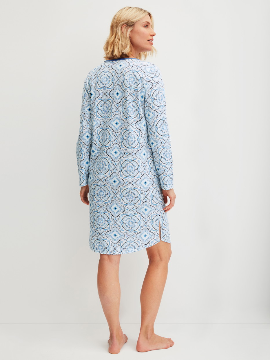 Women model is wearing Long Sleeve Nightdress – 100 cm Length made of 100% Cotton in Blue, Patterned from the Cotton Special series by CALIDA, Back view