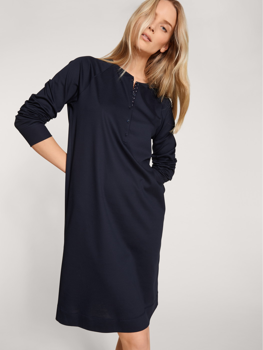 Women model is wearing House dress made of 100% Cotton in Blue, Unicoloured from the Favourites Dreams series by CALIDA, Front view