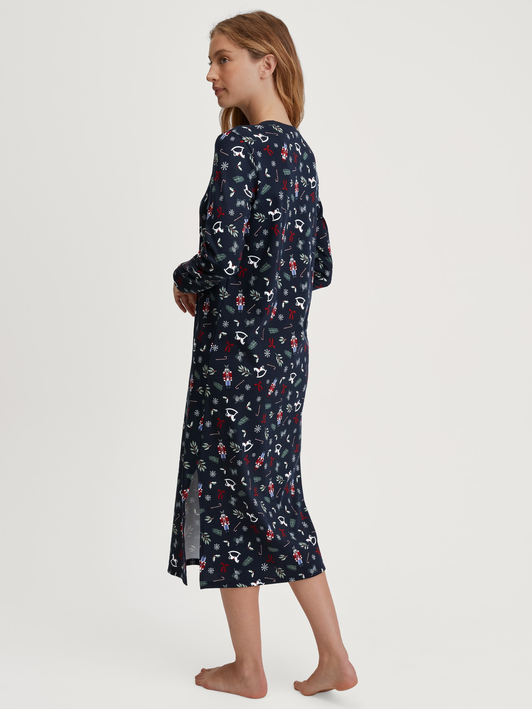 Women model is wearing Long Sleeve Nightdress – 120 cm Length made of 100% Cotton in Blue, Patterned from the Family & Friends series by CALIDA, Back view