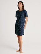 Women model is wearing Nightdress, length 95 cm made of 100% Cotton in Blue, Motif from the Sweet Dreams series by CALIDA, Front view