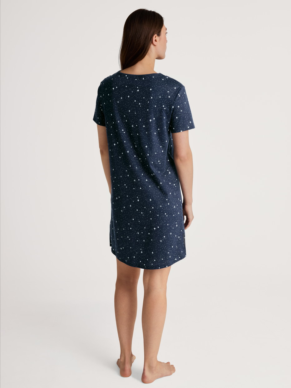 Women model is wearing Nightdress, length 95 cm made of 100% Cotton in Blue, Motif from the Sweet Dreams series by CALIDA, Back view