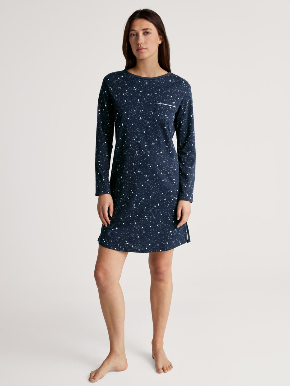 Women model is wearing Long Sleeve Nightdress – 95 cm Length made of 100% Cotton in Blue, Motif from the Sweet Dreams series by CALIDA, Front view