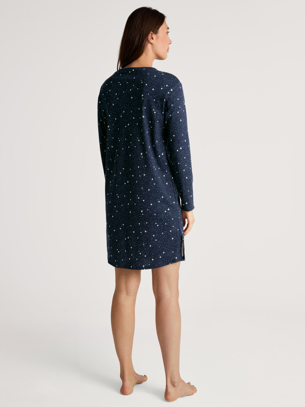 Women model is wearing Long Sleeve Nightdress – 95 cm Length made of 100% Cotton in Blue, Motif from the Sweet Dreams series by CALIDA, Back view