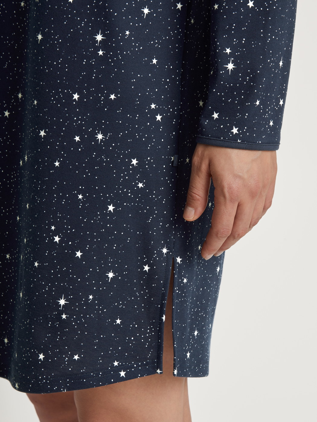 Women model is wearing Long Sleeve Nightdress – 95 cm Length made of 100% Cotton in Blue, Motif from the Sweet Dreams series by CALIDA, Detail
